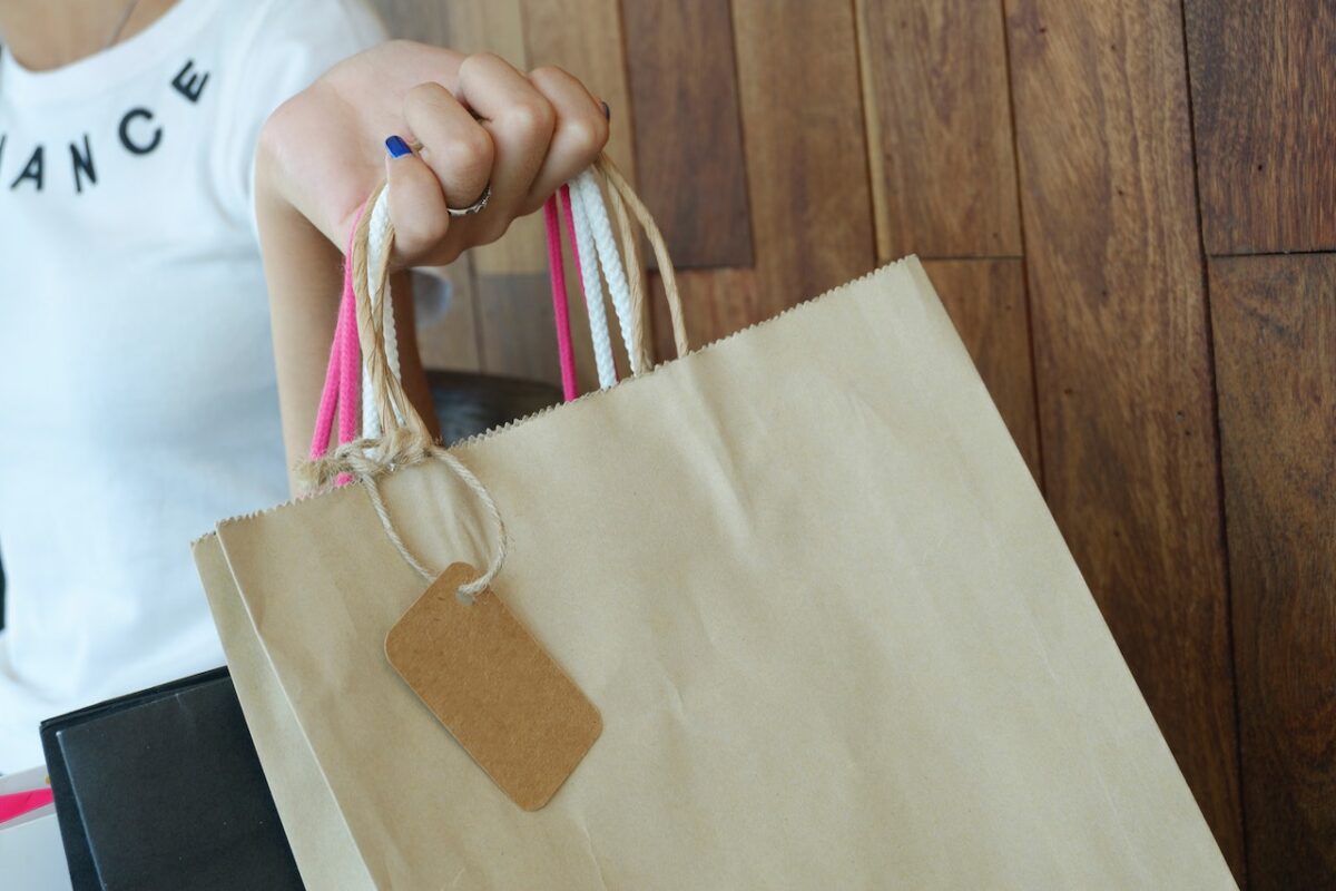 Person holding shopping bag